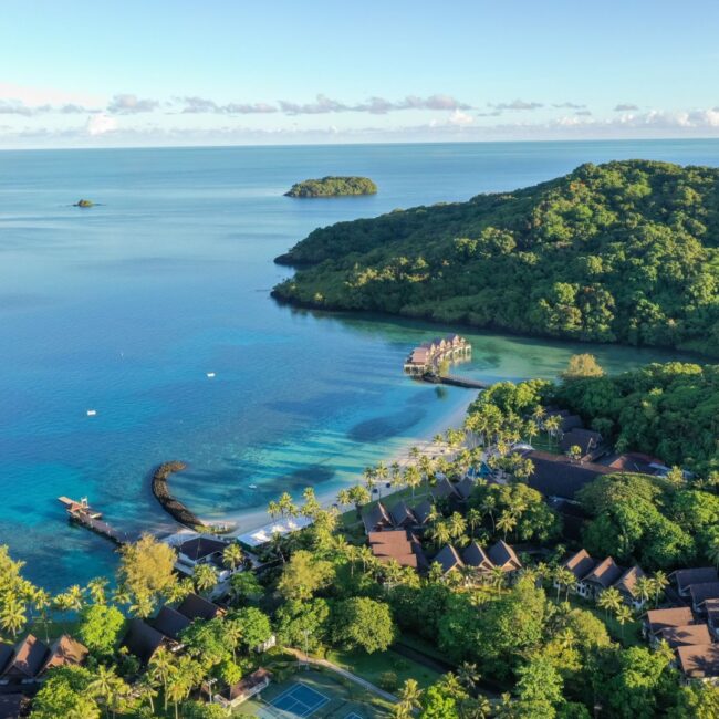 Eco travel along coastline in Palau with beach and mountains