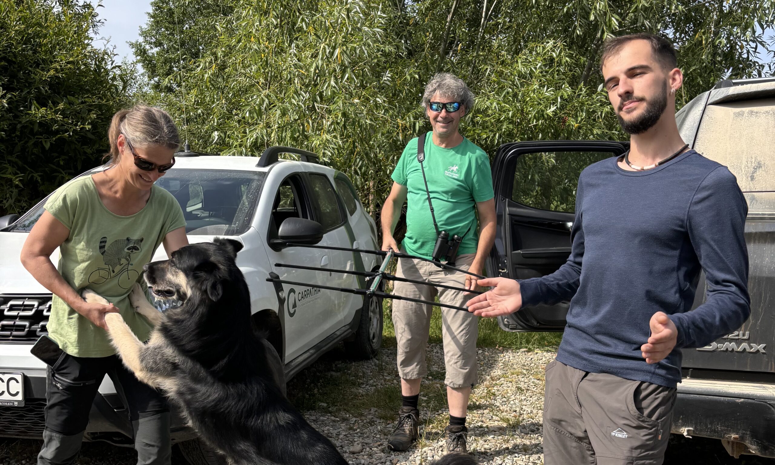 Three biologists getting their equipment ready to track bison in Romania