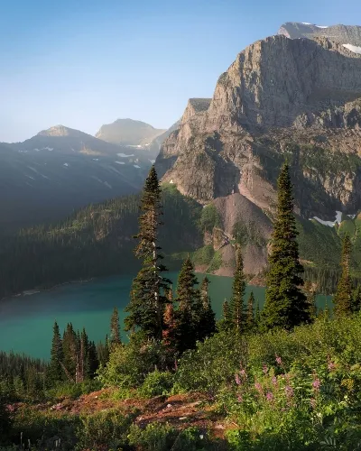 Mountains and trees surrounding a lake seen on a Montana adventure