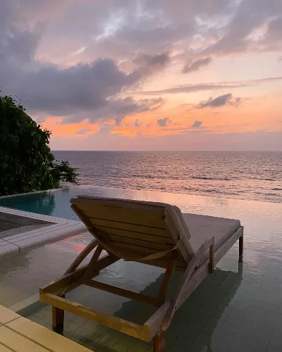 Sitting at your luxury Seychelles_ destinations enjoying the sunrise