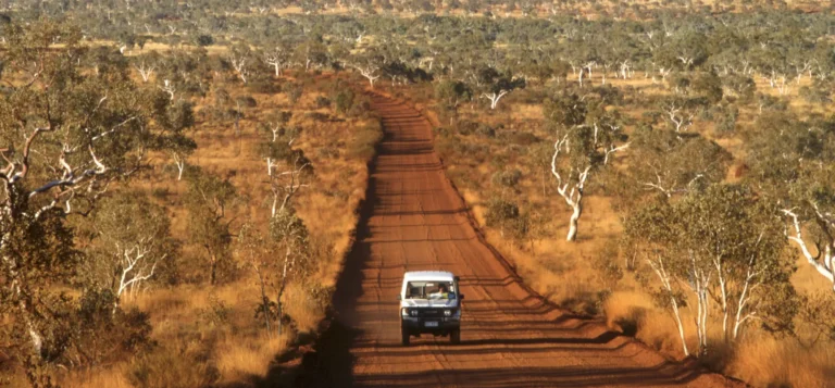 Car driving through the outback as part of Australia's conservation programme