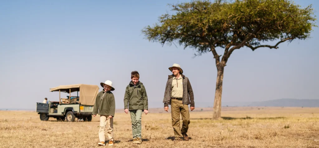 Family walking on a family safari in Africa