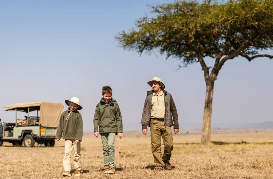 Family walking on a family safari in Africa