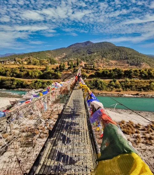 Colourful flags on a bridge in Bhutan