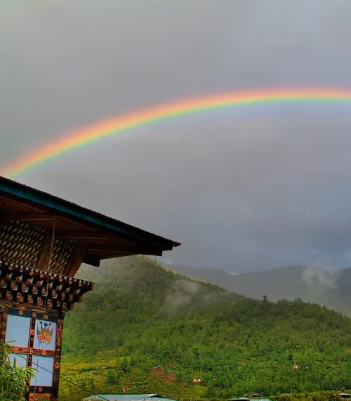 Rainbow over countryside in Bhutan